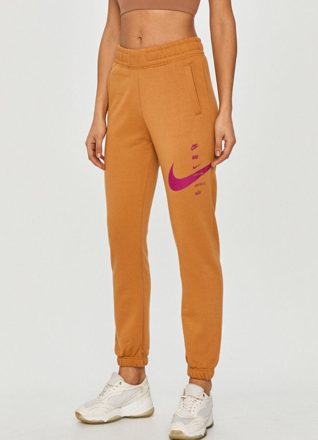 Nike Sportswear - Spodnie brzoskwiniowy CU5631